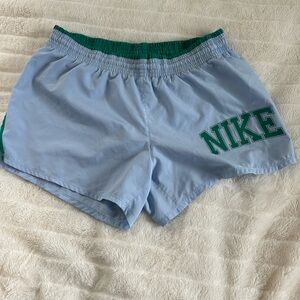 Blue and green vintage Nike shorts with built-in underwear